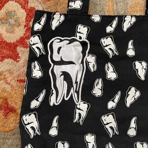 Sourpuss tooth tote bag